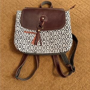 Myra black and white canvas pattern mini backpack with leather flap and tassel